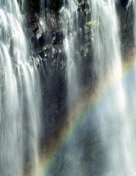 Waterfalls with a rainbow in front.